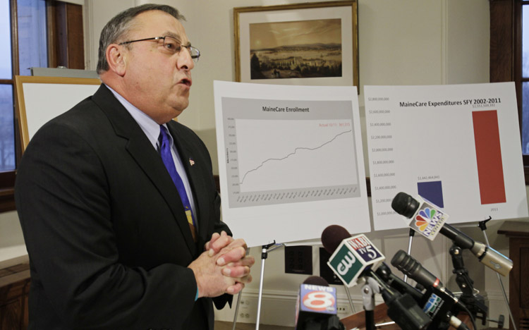 Gov. Paul LePage answers questions at a news conference at the State House today, where he proposed tougher Medicaid eligibility standards as part of his plan to balance the budget.