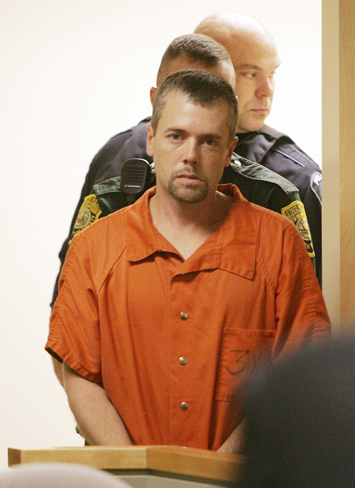 In this Nov. 10, 2010, photo, Christopher Smeltzer arrives for arraignment in District Court in Candia, N.H.