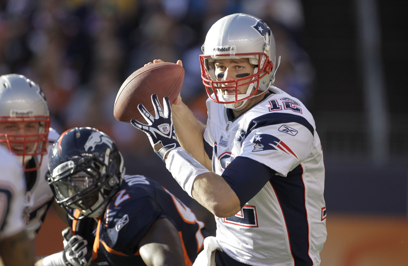 New England Patriots quarterback Tom Brady (12) looks to pass against the Denver Broncos on Dec. 18. Brady had X-rays to check for a separated left shoulder this week, and his participation in practice was limited on Thursday.