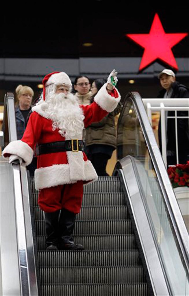 This Wednesday, Dec. 22, 2010 file photo shows Phil Martella dressed as Santa Claus as he arrives at a mall for seasonal photographs with children in Buffalo, N.Y. (AP Photo/David Duprey, File)