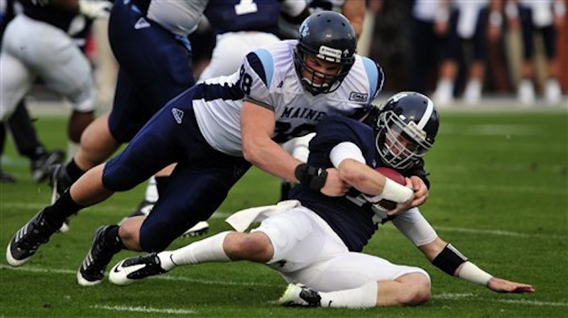 Georgia Southern quarterback Jaybo Shaw (14) is tackled by Maine defensive lineman Craig Capella (98) during the first half of an NCAA college football game, Saturday, Dec. 10, 2011 in Statesboro, Ga. (AP Photo/Stephen Morton)