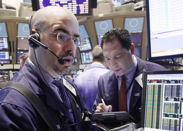 Traders work on the floor of the New York Stock Exchange. This week's strong stock performance is partially a reflection of the market's increased volatility since August, when concerns that Europe's debt was spinning out of control made dramatic stock price swings the norm.