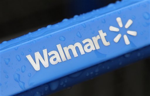 This photo taken Nov. 14, 2011, shows the rain-soaked handle of a shopping cart outside the Wal-Mart store in Mayfield Hts. Wal-Mart has pulled a batch of powdered infant formula from more than 3,000 of its stores nationwide after a newborn Missouri boy who was given the formula died. (AP Photo/Amy Sancetta, File)