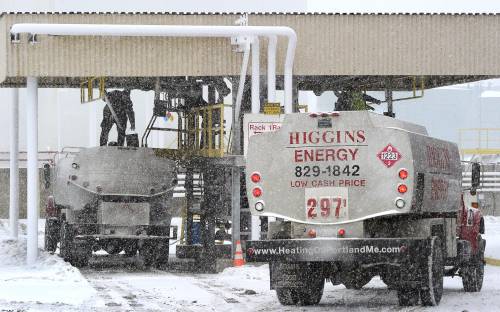 Local oil company trucks fill up at the Sprague facility in South Portland last winter.