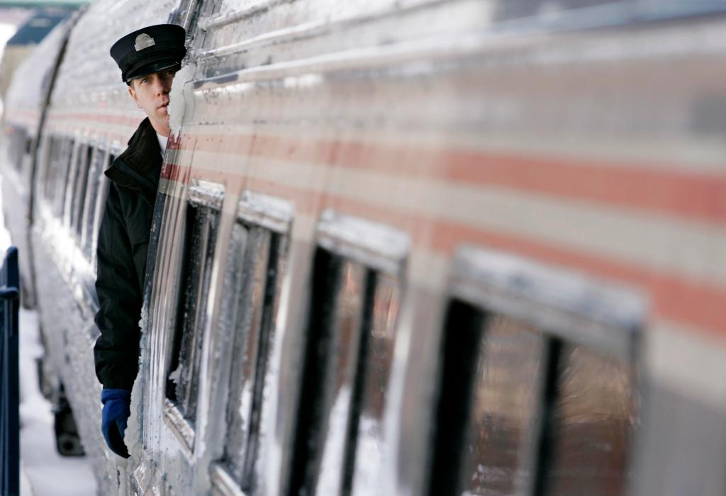 A conductor keeps watch as the Amtrak Downeaster arrives in Portland, Maine, Friday, Dec. 14, 2007. The Downeaster is celebrating its 10th birthday. (AP Photo/Robert F. Bukaty)