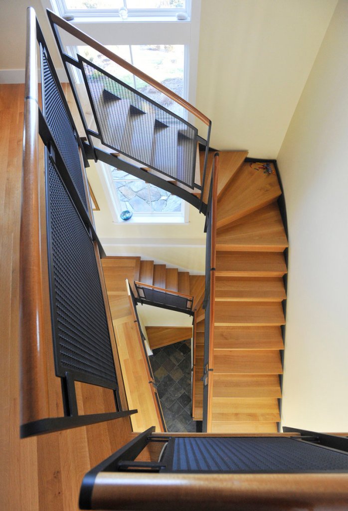 The wood and steel staircase is central to the Grays’ home.