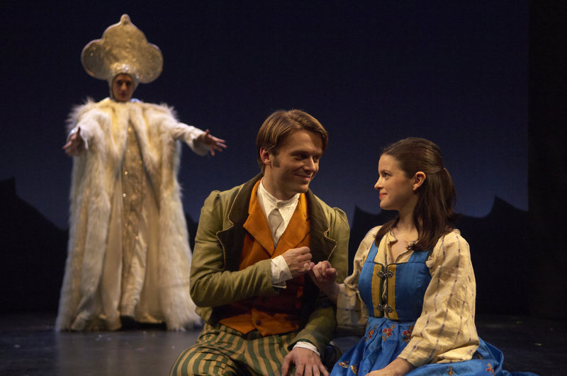 Kai (Ian Carlsen) and Gerda (Lauren Orkus) promise their everlasting friendship to each other, observed by the Snow Queen (Patricia Buckley) in this scene from the Portland Stage Company adaptation of the Hans Christian Andersen fairy tale “The Snow Queen.” The show continues through Dec. 24.