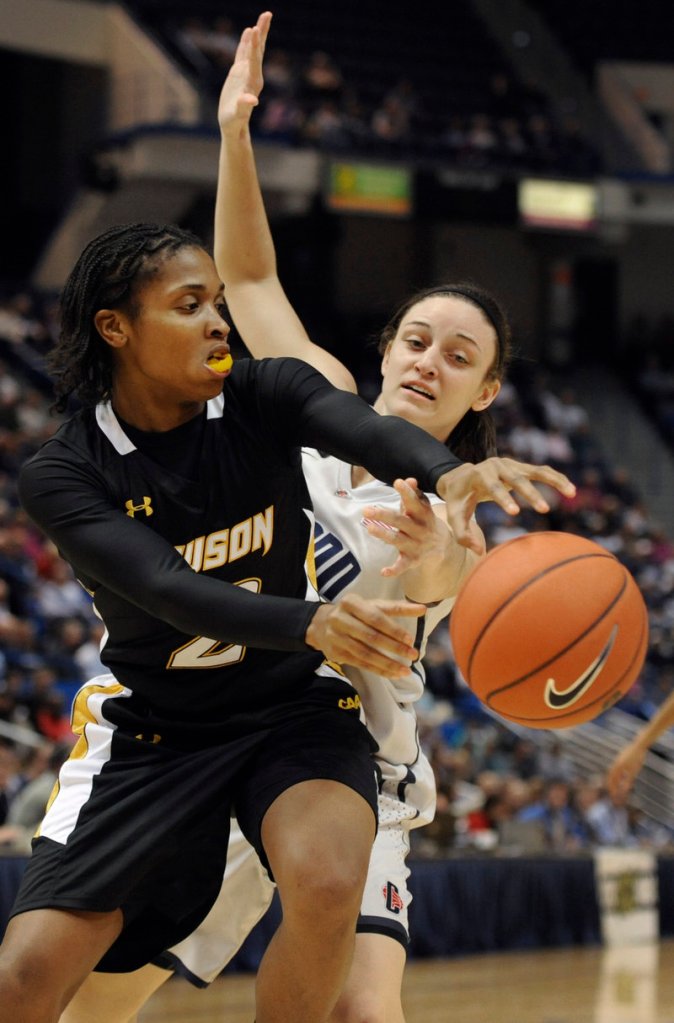 Deree Fooks of Towson tries to get a pass off Wednesday night while defended by Kelly Faris of Connecticut during the first half of second-ranked UConn’s 92-31 victory.