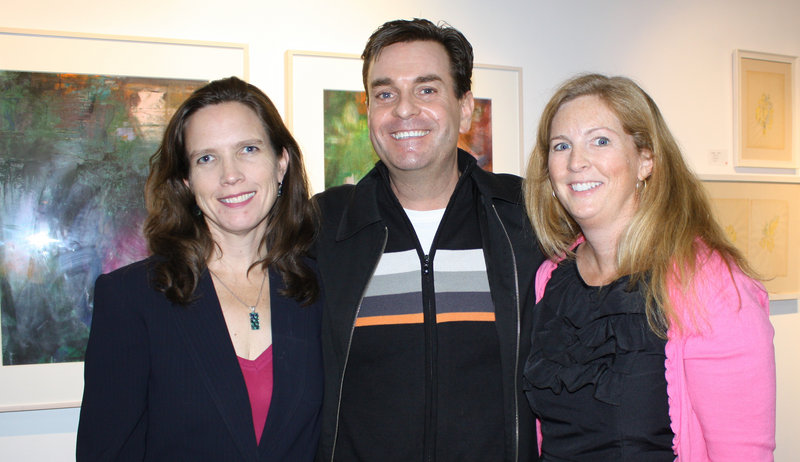 Jennifer Hutchins, executive director of Creative Portland, public relations consultant Rob Gould and Kristen Levesque, of the Portland Museum of Art. About 200 guests gathered Wednesday to tour and toast Portland’s POP gallery.