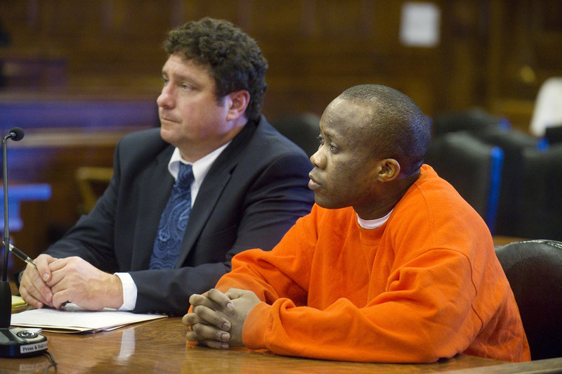 Daudoit Butsitsi, 25, of Portland is sentenced in Cumberland County Superior Court on Thursday to 38 years in prison for the murder of 24-year-old Serge Mulongo in 2010. At left is his court-appointed defense attorney, Anthony Sineni.
