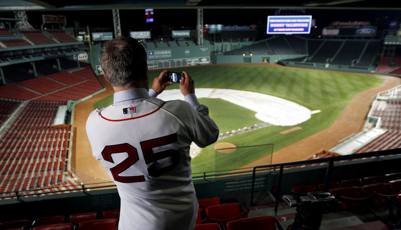 Bobby Valentine uses his phone to take a picture of Fenway Park after Thursday’s press conference. Valentine has 15 years of managerial experience with the Rangers and Mets, but hasn’t managed in the majors since 2002.