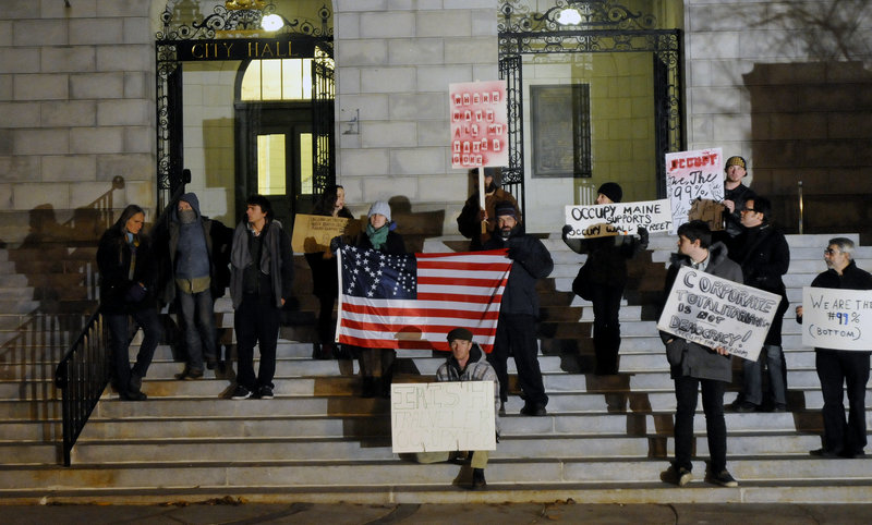 Members of the Occupy Maine movement assemble on the steps of Portland City Hall on Thursday before a Public Safety Committee hearing on an application by the protesters group to remain in Lincoln Park.