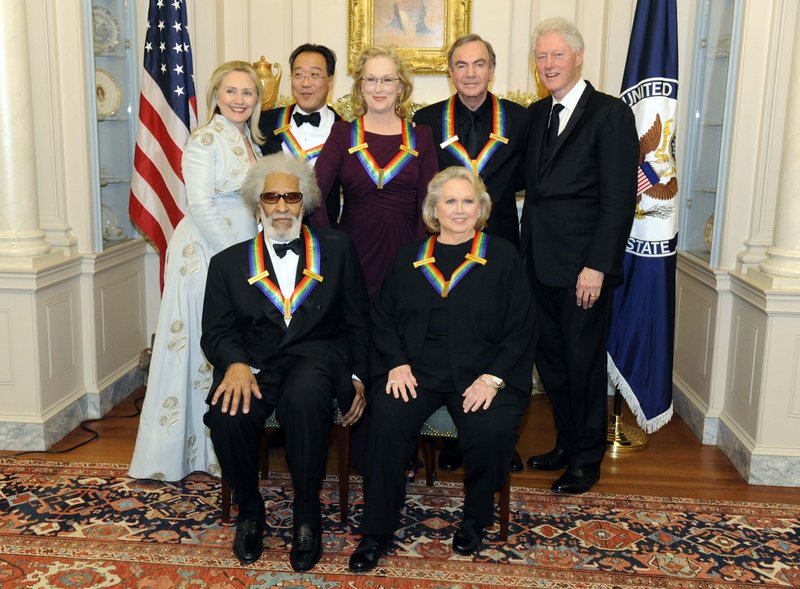 Secretary of State Hillary Clinton, left, and former President Clinton pose with the 2011 Kennedy Center honorees – front, Sonny Rollins, left, and Barbara Cook, and back, Yo-Yo Ma, left, Meryl Streep and Neil Diamond – after a dinner and reception Saturday.