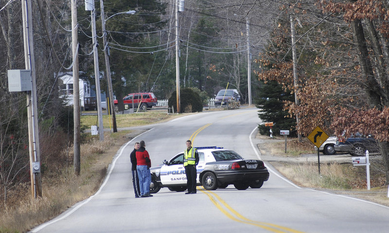 Police block off New Dam Road in Sanford during the search for fugitive David Hobson on Monday. They also questioned relatives of Hobson who live on New Dam Road.