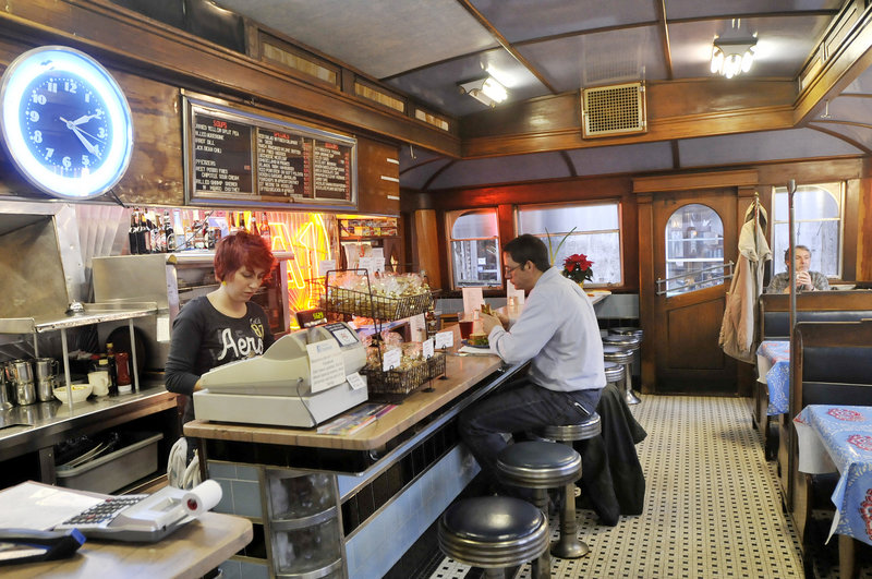 Eliza Robbins works the counter at A-1 Diner in Gardiner as Chuck Schlicher enjoys lunch.