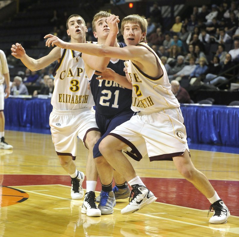 Aaron Todd, center, of York and Henry Babcock, right, of Cape Elizabeth, could have more battles this season. York may be one of the teams to beat in Western Class B and the Capers always are a tough opponent.
