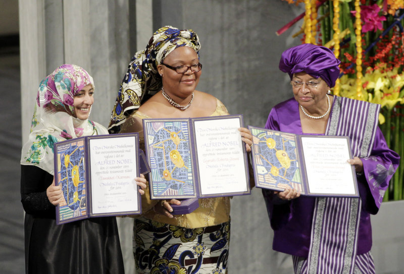 Nobel Peace Prize winners, from left, Tawakkol Karman of Yemen, Leymah Gbowee of Liberia and Liberian President Ellen Johnson Sirleaf display their awards in Oslo Saturday.