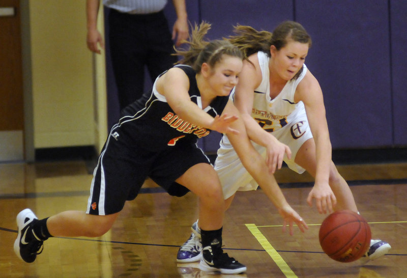 Carissa Gelinas, left, of Biddeford and Abby Maker of Cheverus head for a loose ball during their Western Class A game in Portland. Cheverus won, 68-28.