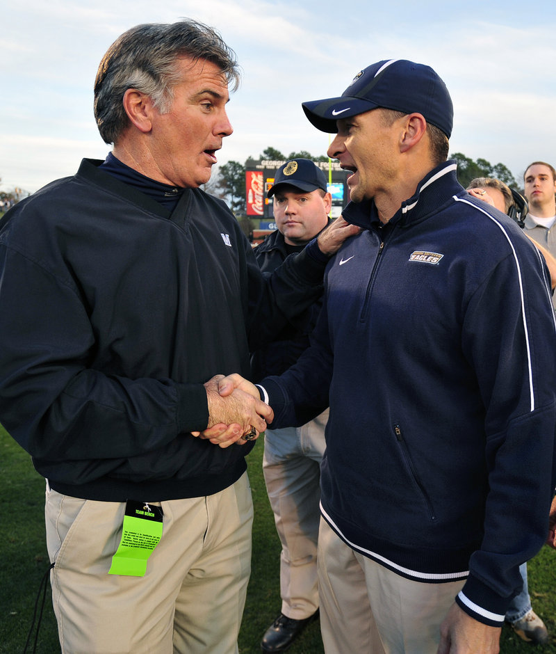 Maine Coach Jack Cosgrove, left, congratulates his counterpart, Jeff Monken of Georgia Southern, after the Black Bears fell, 35-23.