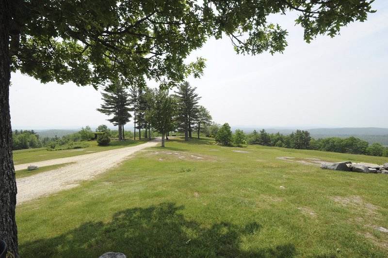 The road to the top of Hacker’s Hill in Casco ends at a clearing that offers views of the Sebago Lake region, the White Mountains and the Mahoosuc Range near Bethel.