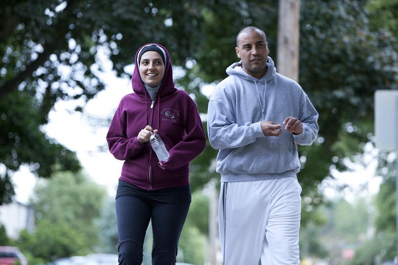 Pediatric respiratory therapist Nawal Aoude, left, and her husband, Nader, go out for a walk in a scene from “All-American Muslim.” A conservative Christian group’s email drive prompted Lowe’s to pull its ads from the series.