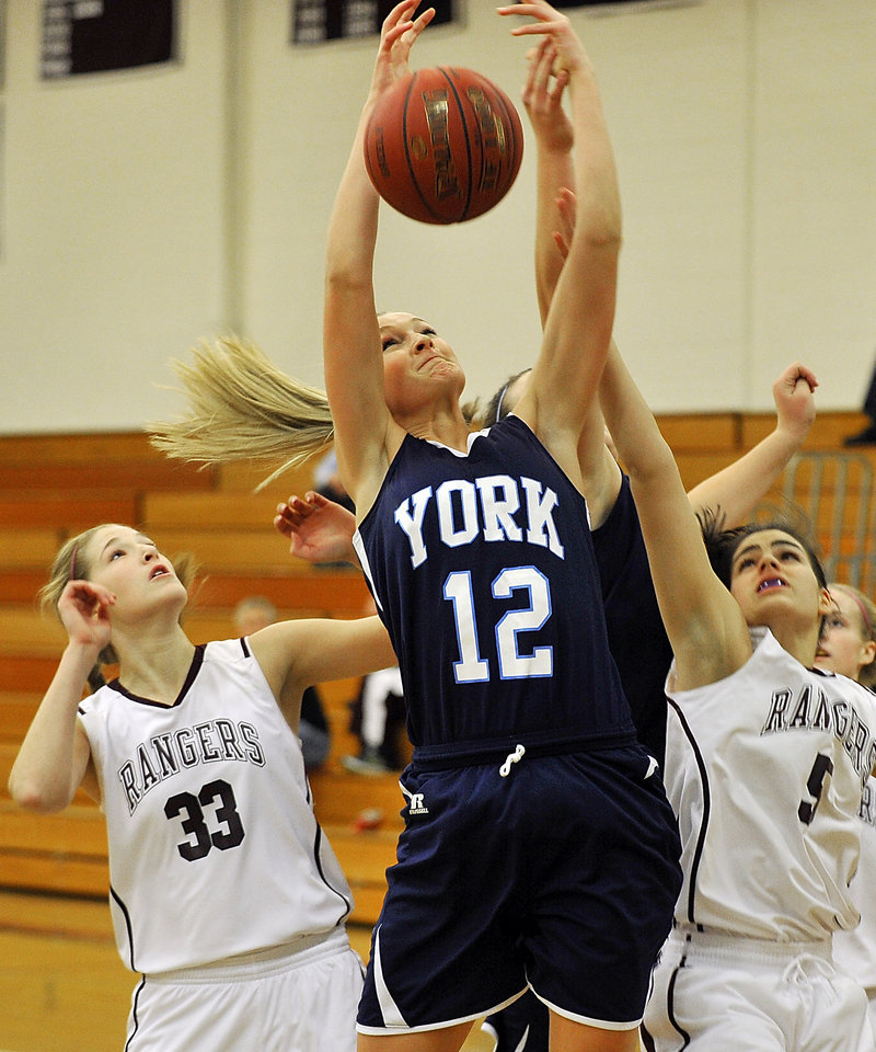 Emily Campbell of York contends for a rebound with Greely’s Marina Goding in Tuesday’s game at Cumberland. Greely rallied for a 43-41 win.