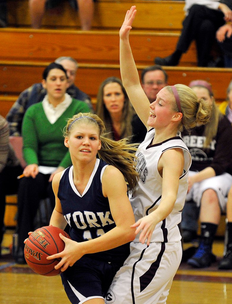 Andrea Mountford of York seeks to pass while being guarded by Greely’s Caroline Hamilton Tuesday night.