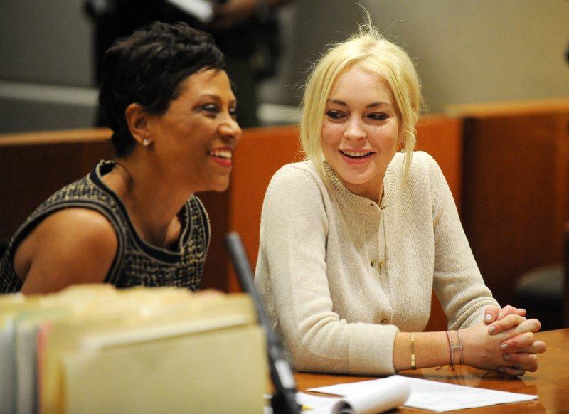 Lindsay Lohan, right, and attorney Shawn Chapman Holley are seen during a progress report session at the Los Angeles Superior Court Wednesday.
