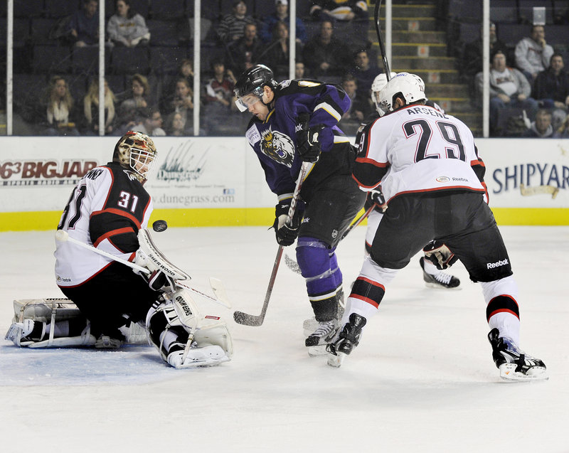 Linden Vey of the Manchester Monarchs seeks a rebound Wednesday night after being stymied by goalie Curtis McElhinney of the Portland Pirates.