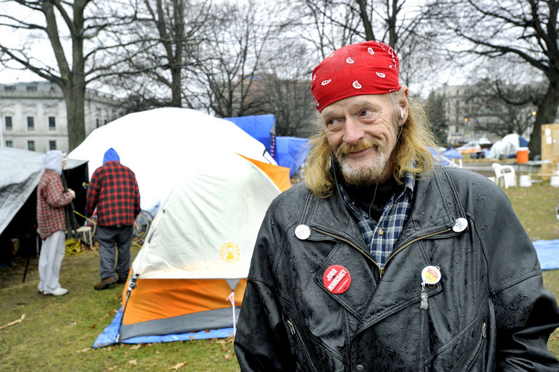 Occupy Maine member Harry Brown spends time Thursday in Lincoln Park. The group has camped there since October to call attention to corporate greed and socioeconomic injustice.