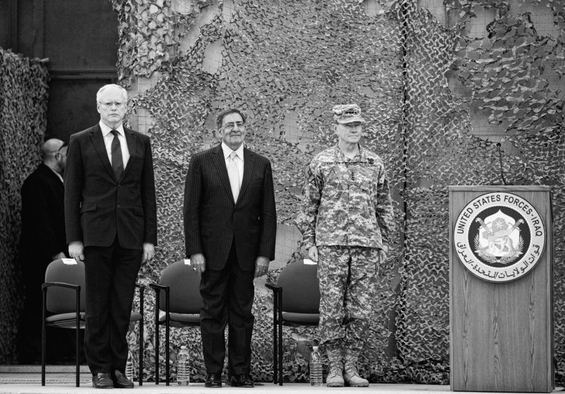 Ambassador to Iraq James Jeffrey, left, and Secretary of Defense Leon Panetta, center, stand during ceremonies in Baghdad, Iraq, on Thursday.