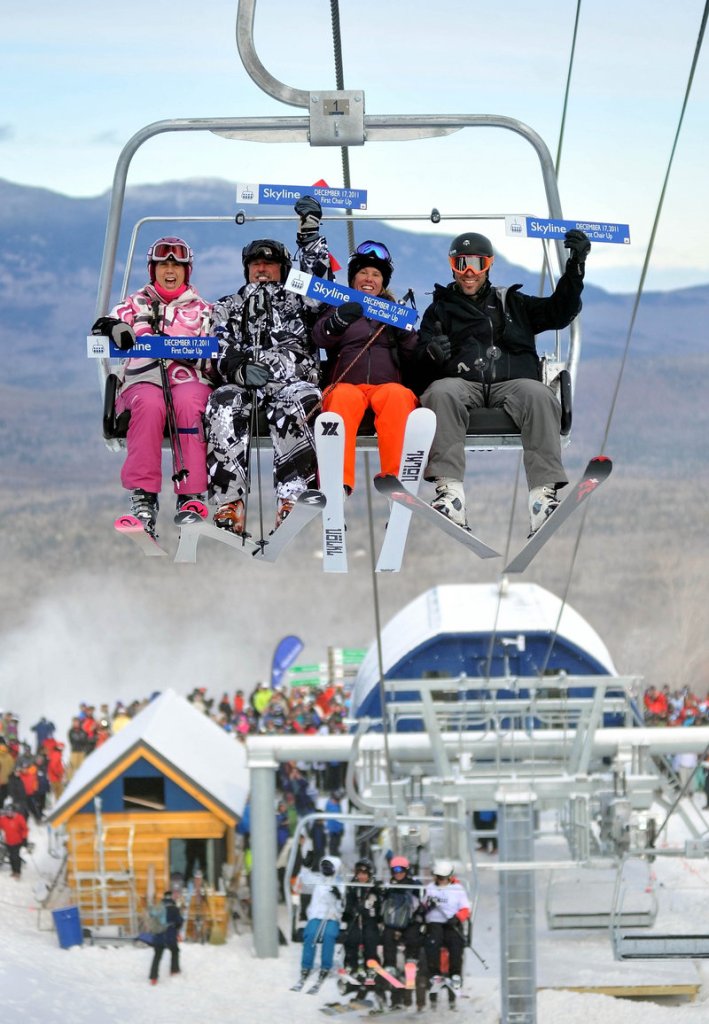 From left, Meredith Strang Burgess, Doug Stewart, Chris Proulx and Chad Coleman are the first skiers to ride the brand-new Skyline lift at Sugarloaf Mountain on Saturday.