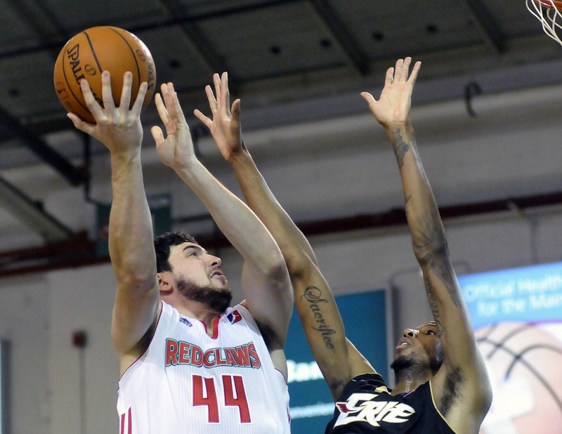 Dominic Calegari of the Maine Red Claws lifts a shot over Greg Washington of the Erie BayHawks during Erie’s 109-105 victory Saturday.