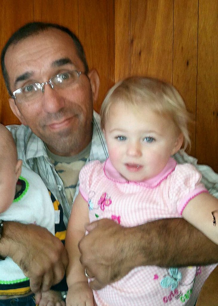 Ayla Reynolds is shown being held by her grandfather, Ronald Reynolds of Portland.