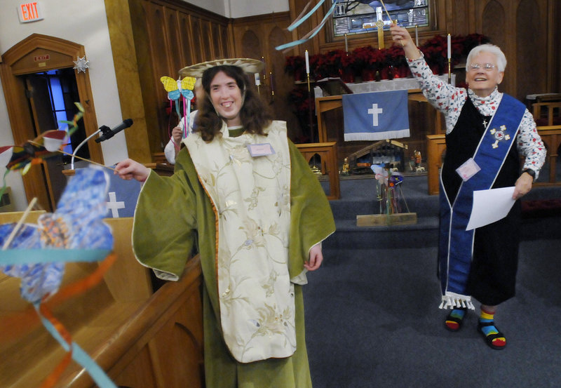 Jennifer Wildes of Buxton, left, takes part on Sunday in Rejoicing Spirits, a service at Trinity Lutheran Church in Westbrook that reaches out to people with special needs and disabilities. Sister Carol Weaver, at right, leads the ecumenical service.