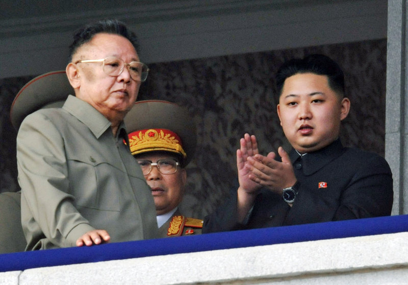 Kim Jong Un, right, and his now-deceased father, Kim Jong Il, attend a military parade last year. North Koreans are unfamiliar with Kim Jong Un, whose name was mentioned in public only 15 months ago and whose father never explicitly endorsed him as his successor.