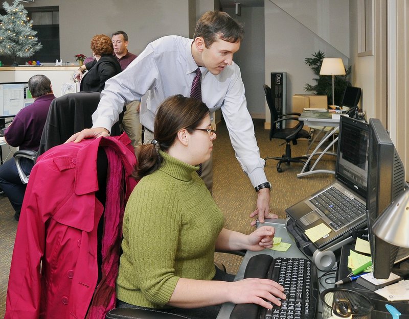 Employees at Winxnet in Portland. The IT company, which employs mostly younger workers, saw its insurance rates drop for 2012.