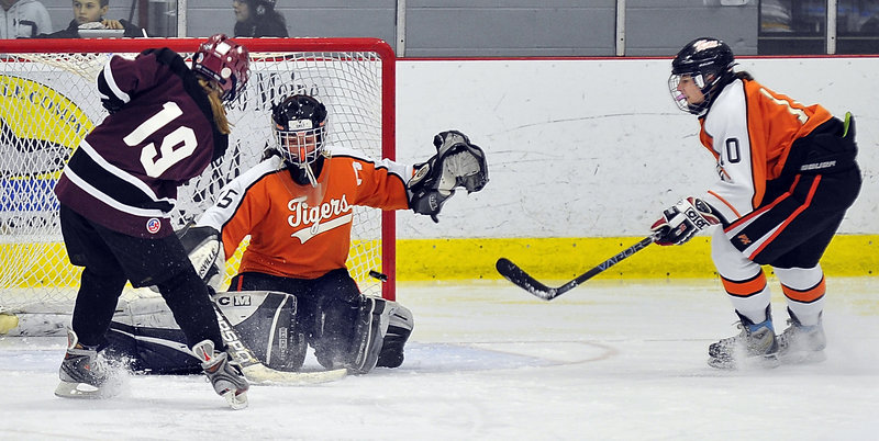 Biddeford goalie Emily Brassley holds her ground and stops a shot by Charlotte Smith of Gorham-Bonny Eagle. Smith did score two goals Wednesday night as Gorham-Bonny Eagle came away with a 5-4 victory.