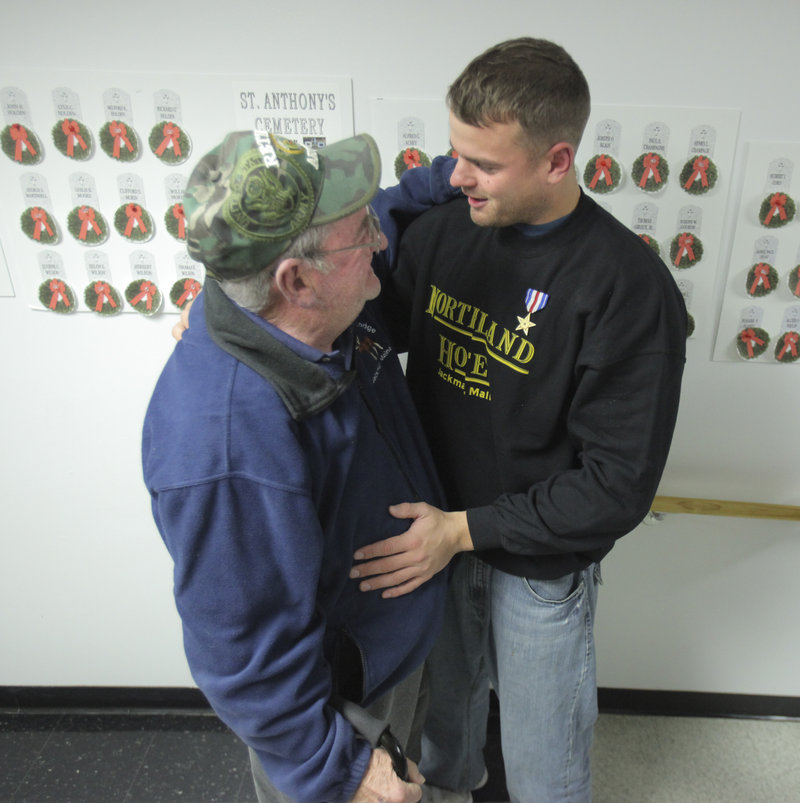 Another Silver Star hero from Jackman, Frank DuBois, hugs Sgt. Timothy Gilboe during a homecoming reception Thursday honoring Gilboe. DuBois received his Silver Star in 1968 during the Vietnam War.