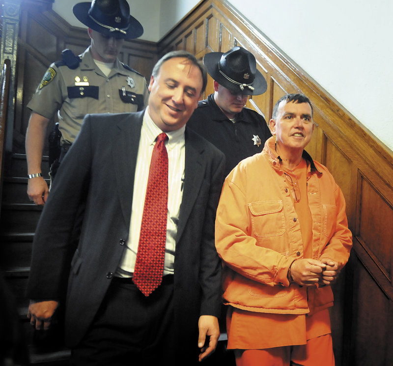 Maine state Rep. Frederick Wintle, R-Garland, right, is escorted back to the Kennebec County jail on May 23 by Maine House Republicans Chief of Staff Earl Bierman, left, and two deputies after Wintle’s Harnish hearing in Kennebec County Superior Court.