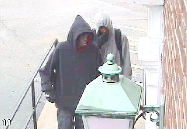 Security cam images of suspects in credit union robbery today.