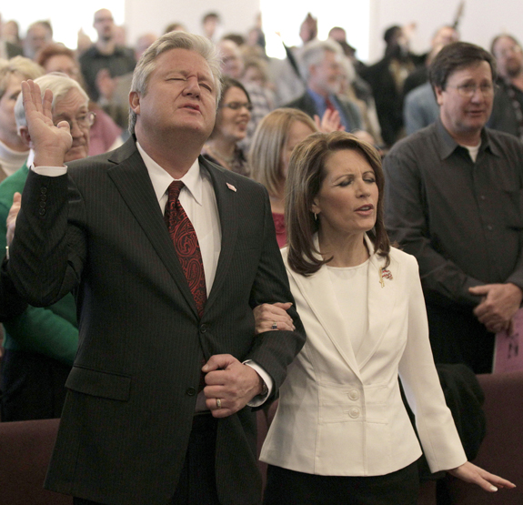 Republican presidential candidate Rep. Michele Bachmann, R-Minn., and her husband Marcus attend services at Jubilee Family Church in Oskaloosa, Iowa, on Sunday.