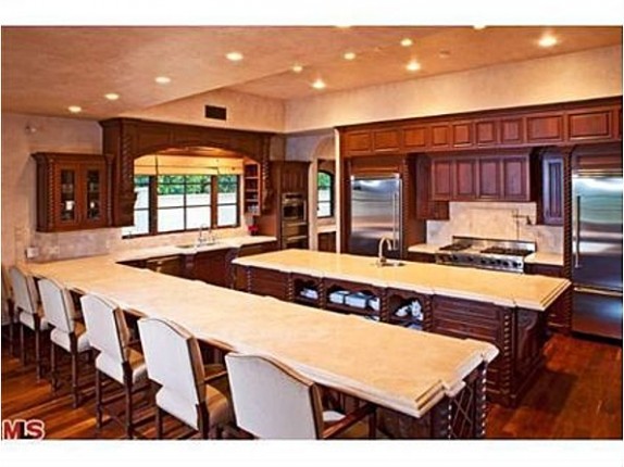 The open kitchen of Avril Lavigne's former home has plenty of seating for guests.