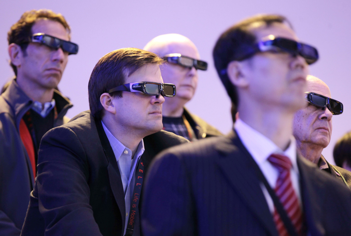 Attendees watch a 3-D HDTV presentation by Panasonic at last year's Consumer Electronics Show.