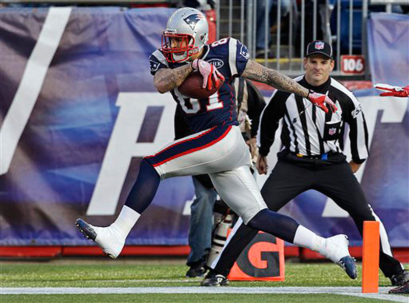 New England Patriots tight end Aaron Hernandez (81) steps into the end zone for a touchdown during the second quarter of an NFL football game against the Buffalo Bills in Foxborough, Mass. (AP Photo/Stephan Savoia) NFLACTION11;