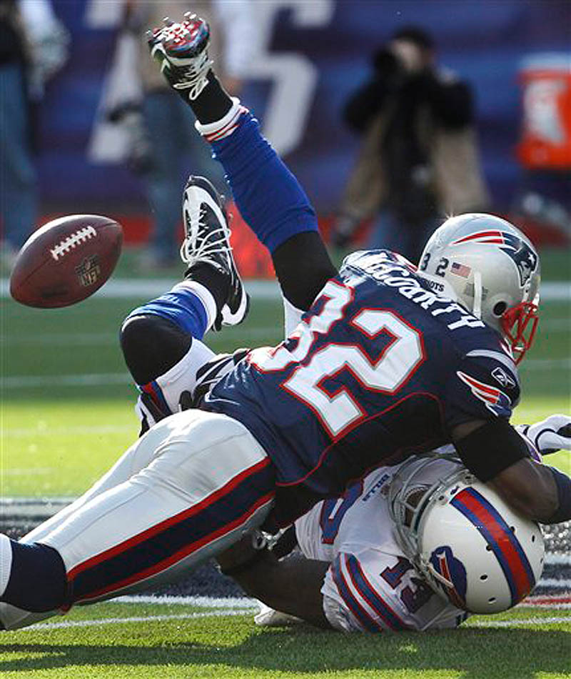 New England Patriots cornerback Devin McCourty (32) levels Buffalo Bills wide receiver Steve Johnson (13) on a pass route during the first quarter of an NFL football game in Foxborough, Mass., Sunday Jan. 1, 2012. (AP Photo/Charles Krupa) NFLACTION11;