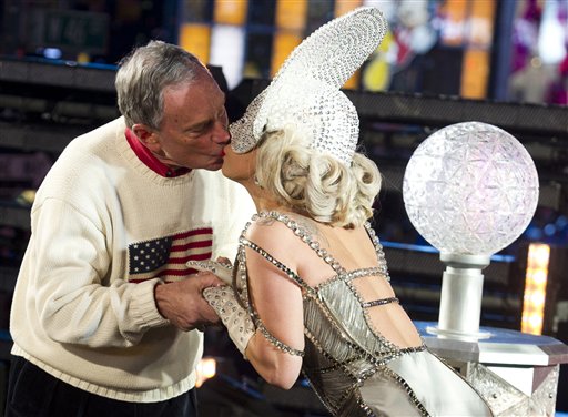 Lady Gaga and New York Mayor Michael Bloomberg, left, kiss during the New Year's celebration on Sunday.