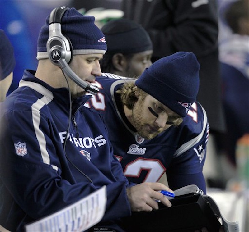 In this Nov. 21, 2010 file photo, New England Patriots quarterback Tom Brady, right, talks with quarterback coach Bill O'Brien during the fourth quarter of a game against the Indianapolis Colts. (AP Photo/Charles Krupa, File)