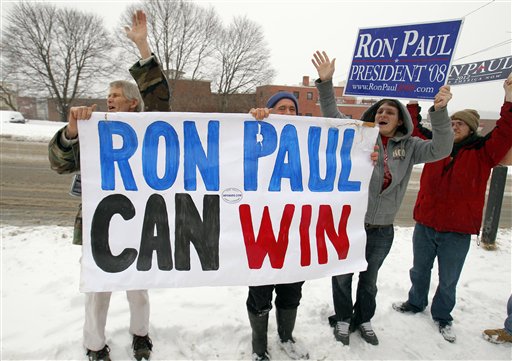Supporters cheer as Republican presidential candidate, Rep. Ron Paul, R-Texas leaves a campaign stop, Friday, Jan. 27, 2012, in Bangor, Maine. (AP Photo/Robert F. Bukaty)