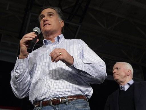 Republican presidential candidate Mitt Romney campaigns with Arizona Sen. John McCain, right, during a town hall style meeting in Manchester, N.H., on Wednesday.